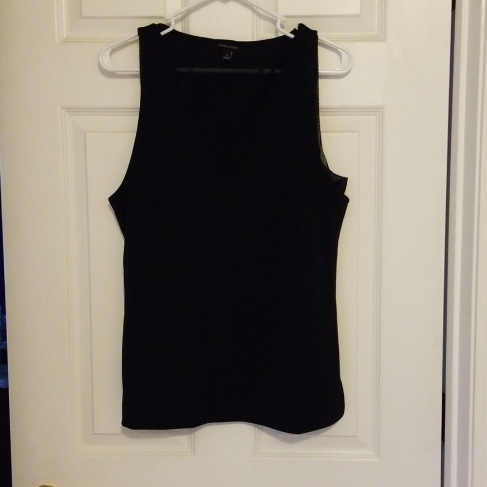 Black sleeveless top with sheer v neck detailing